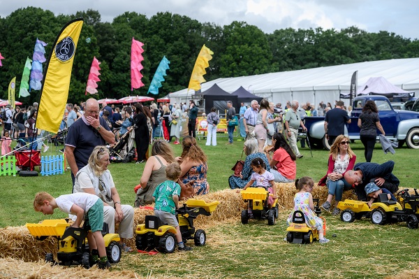 Children's using toy tractors